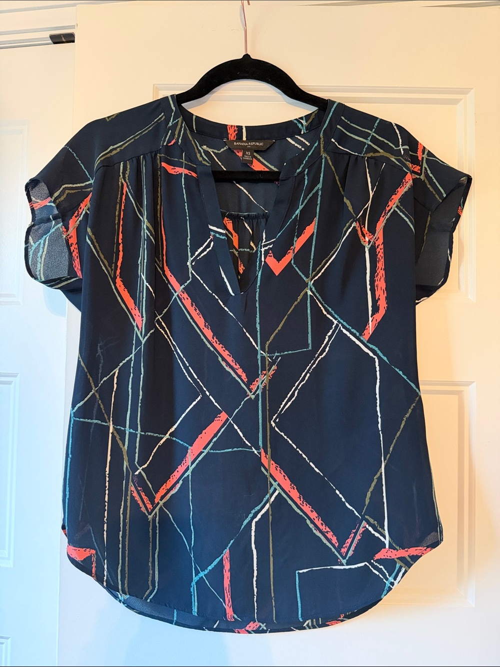 Navy Geometric Print Short Sleeve Dolman top with Coral and Teal Accents